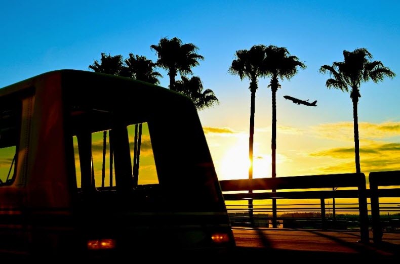 People mover with sunset