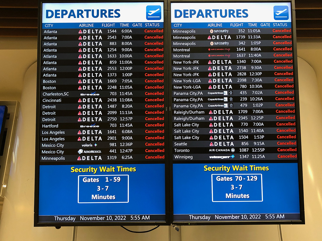 Rare sights to see at Orlando International Airport; empty TSA checkpoint and flight display board with all cancellations